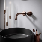Vos Single Lever Wall Mounted Basin Mixer Tap with Slim Spout - Brushed Bronze close up image in situ - 21173BRZMP