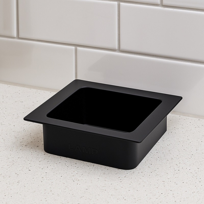 Prestige 108mm Matt Black Sugatsune Square Waste Chute close up in situ - AN-KH008-HLB